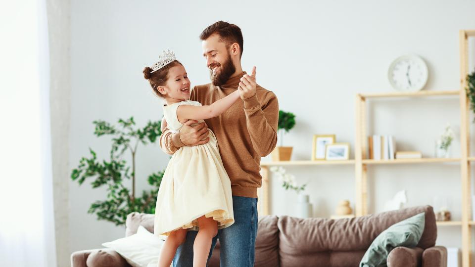 a father and his daughter dancing on fathers day