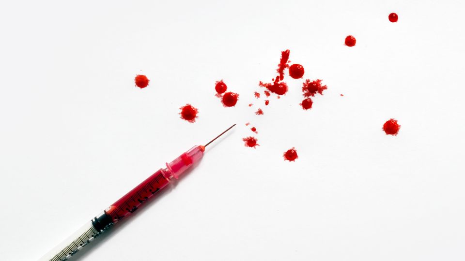 needle with blood in it spilling everywhere contamination
