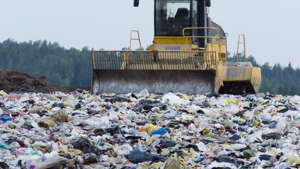Landfill overflowing with heavy machinery