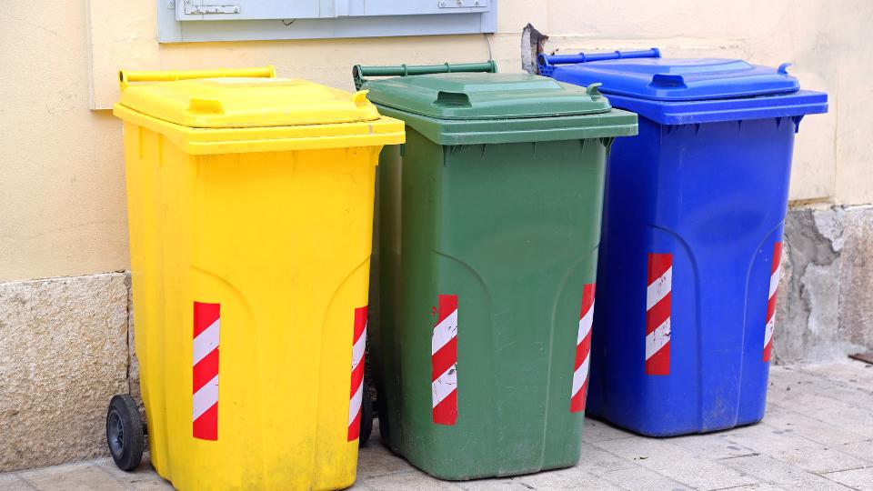 Three different coloured 240L wheelie bins